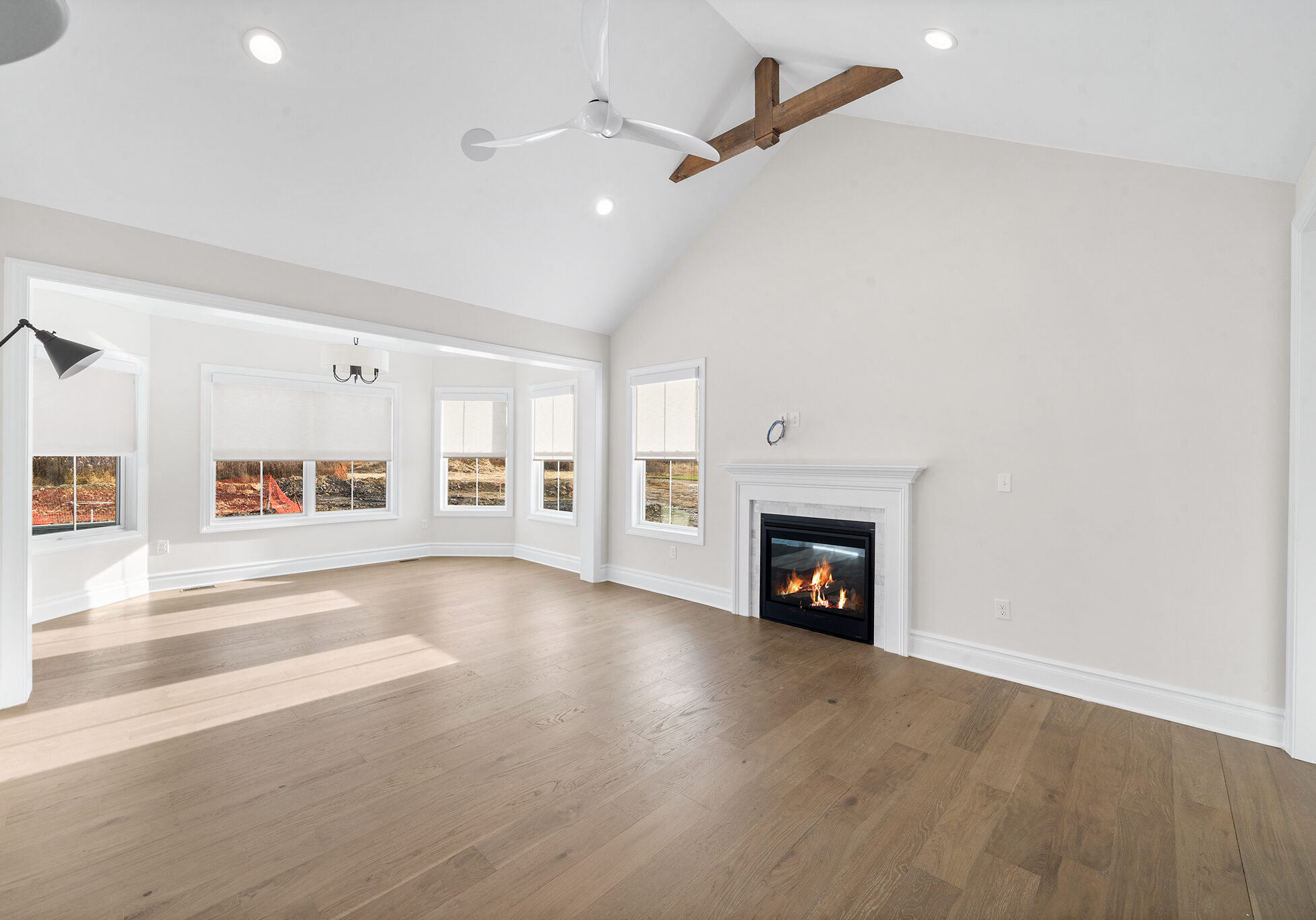 White Master Bedroom With Fireplace